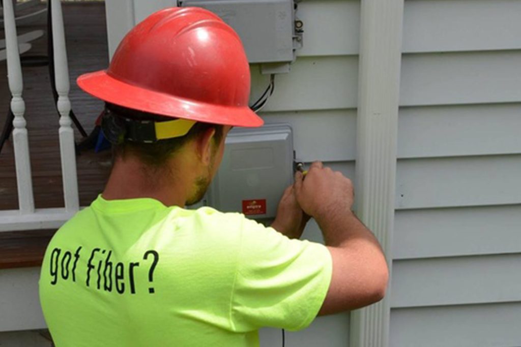 Empire Access technician installing fiber internet at a home