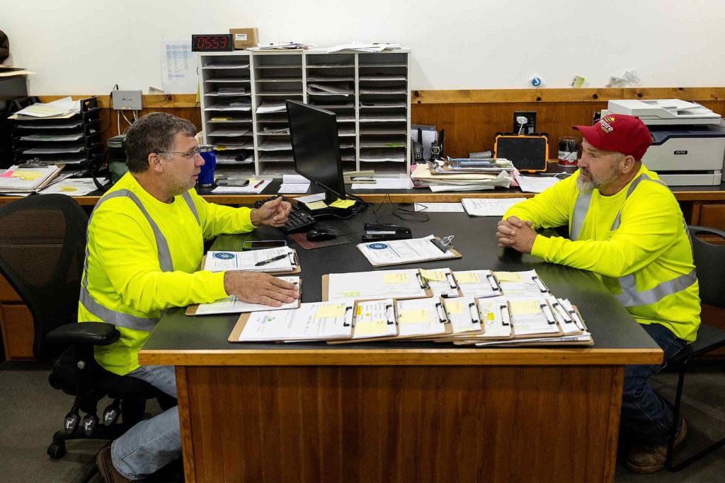 two Empire Access employees meeting to discuss construction and installation plans